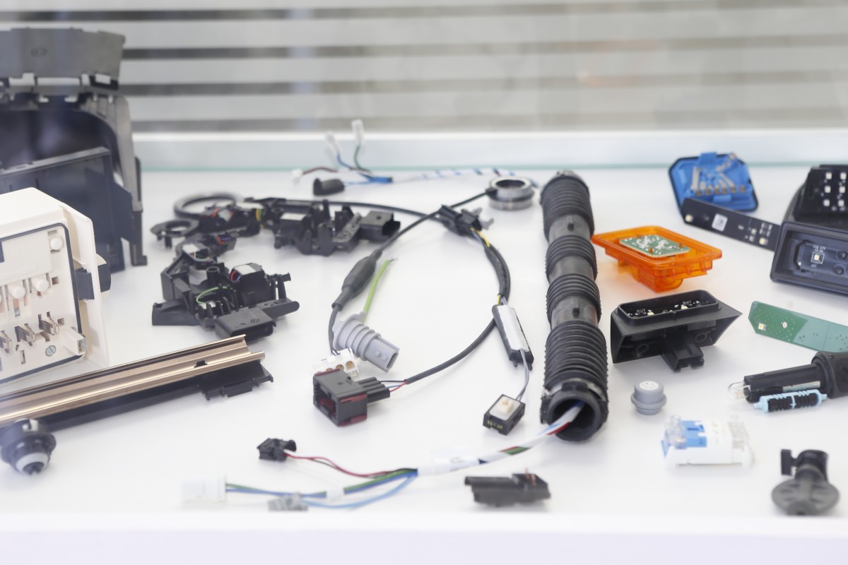 Overmolding parts, harnesses, electronics
